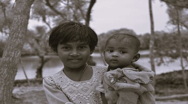 In Her Arms, the World is Still